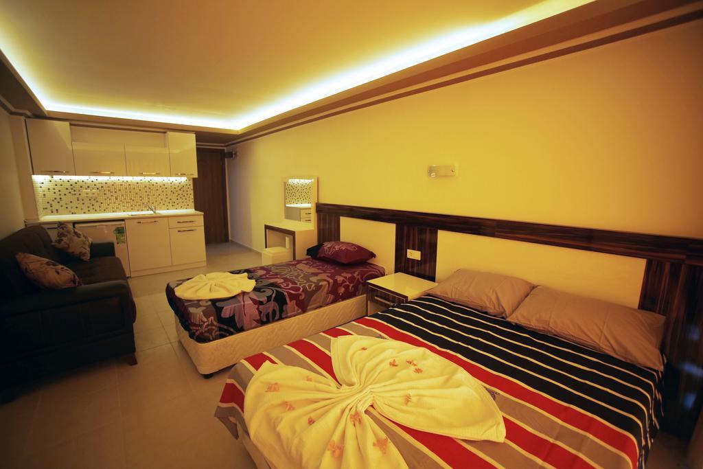 Ustun Apart Pansiyon Alanya Rum bild